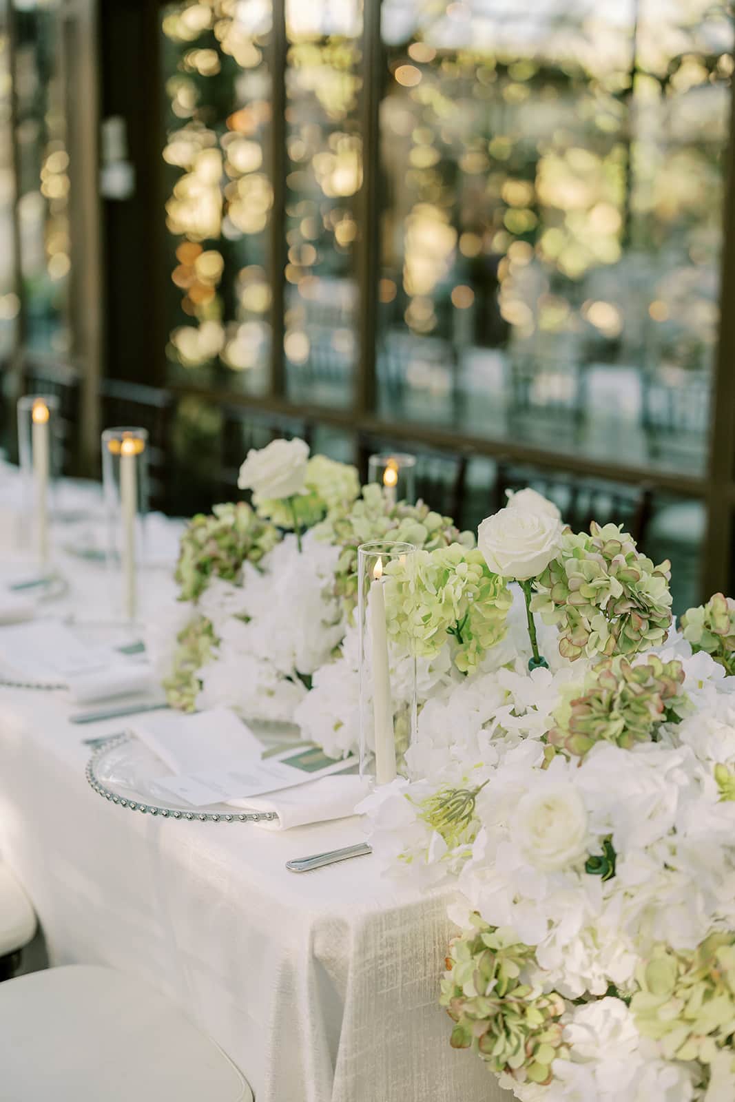 Elegant wedding reception setup inside the glass atrium at The Bryan Museum in Galveston