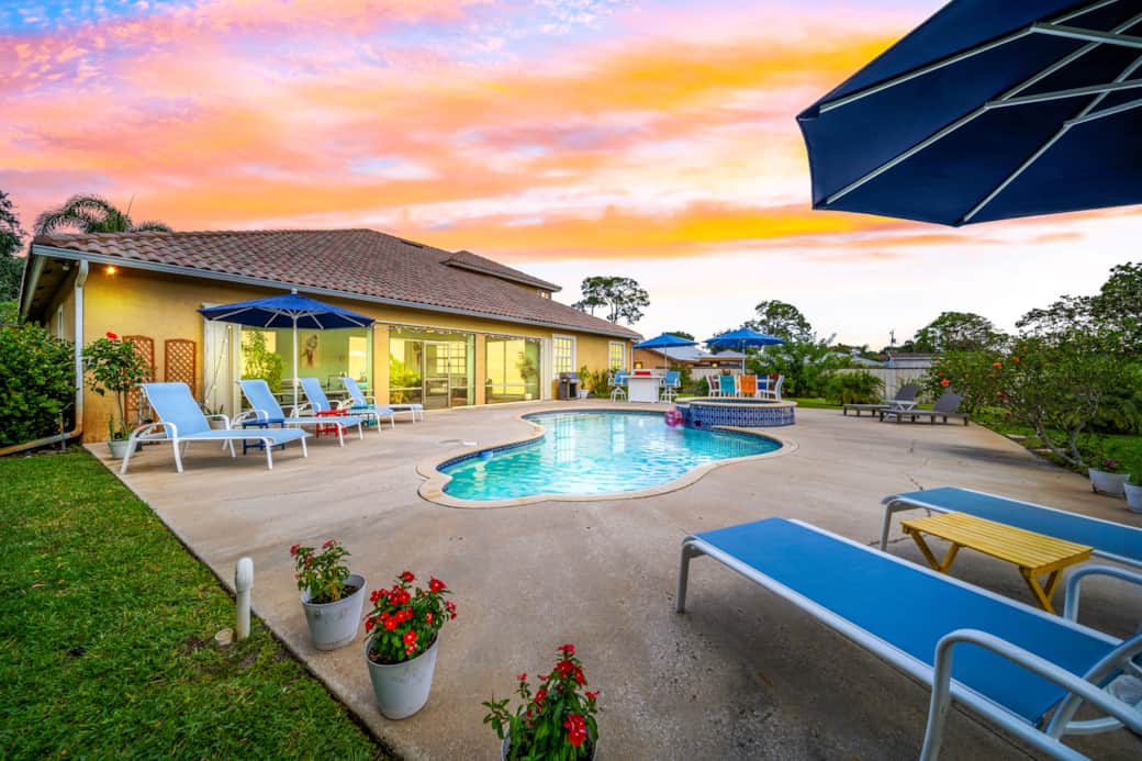 Relax  on the patio by the pool