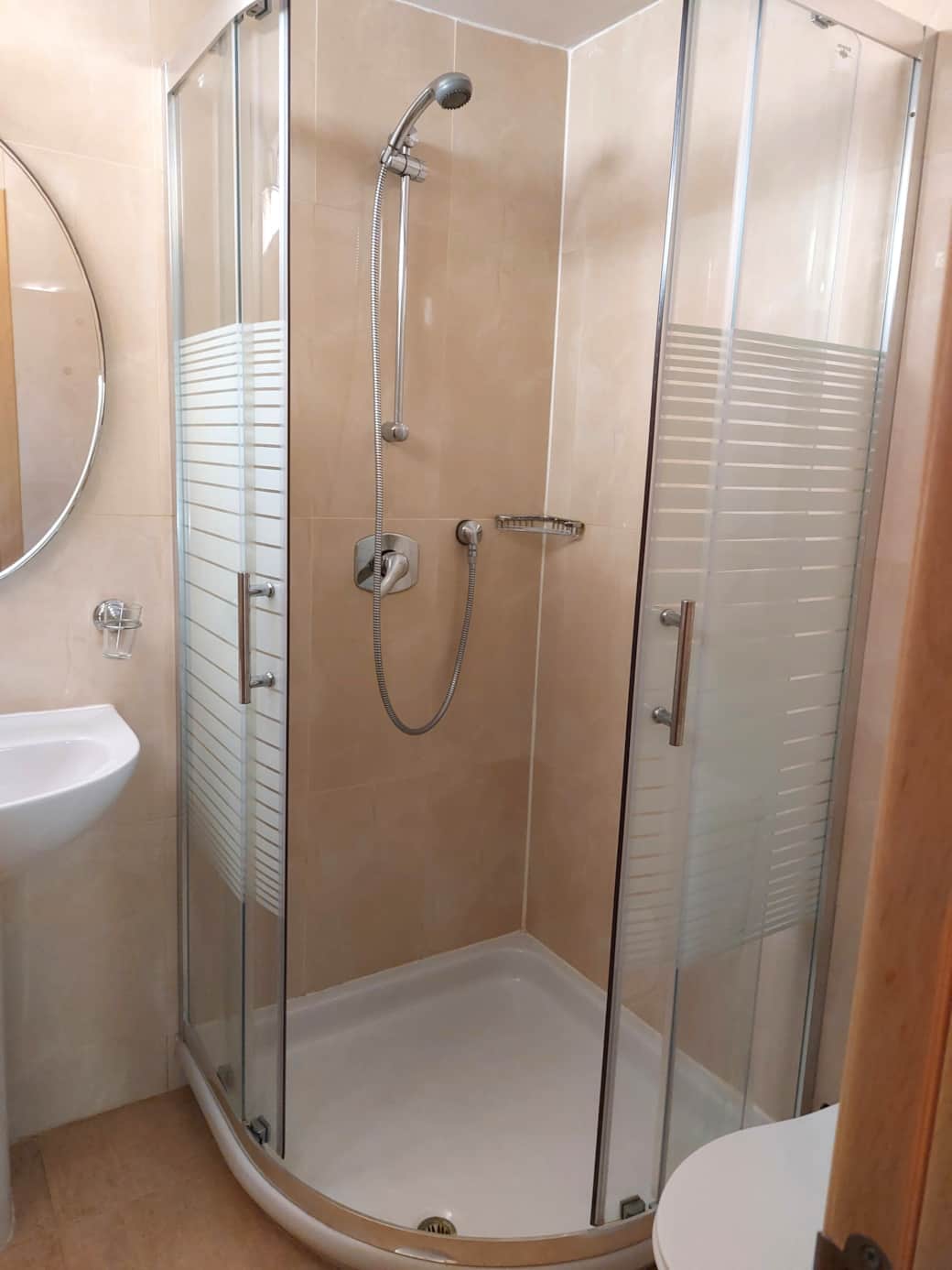 Modern ensuite bathroom (+ additional bathroom) at Litha House, equipped with contemporary fixtures