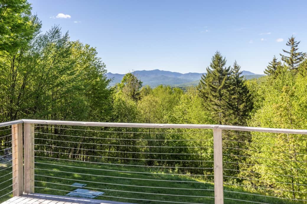 Relax on a private deck with sweeping forest views and Mount Mansfield views. Perfect for morning coffee or sunset unwinding