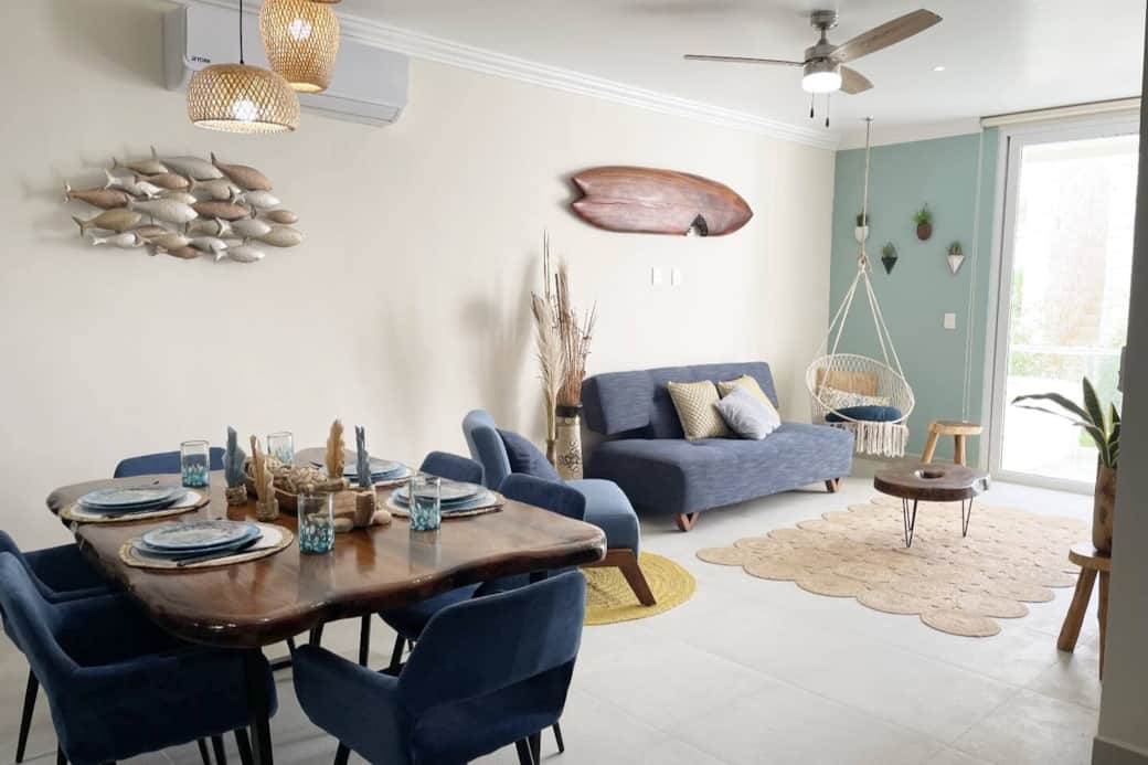 Dine in style on your vacation with this inviting table for six, complete with a spread of exquisite dinnerware. Create lasting memories as you savor delicious meals surrounded by the perfect blend of comfort and luxury.