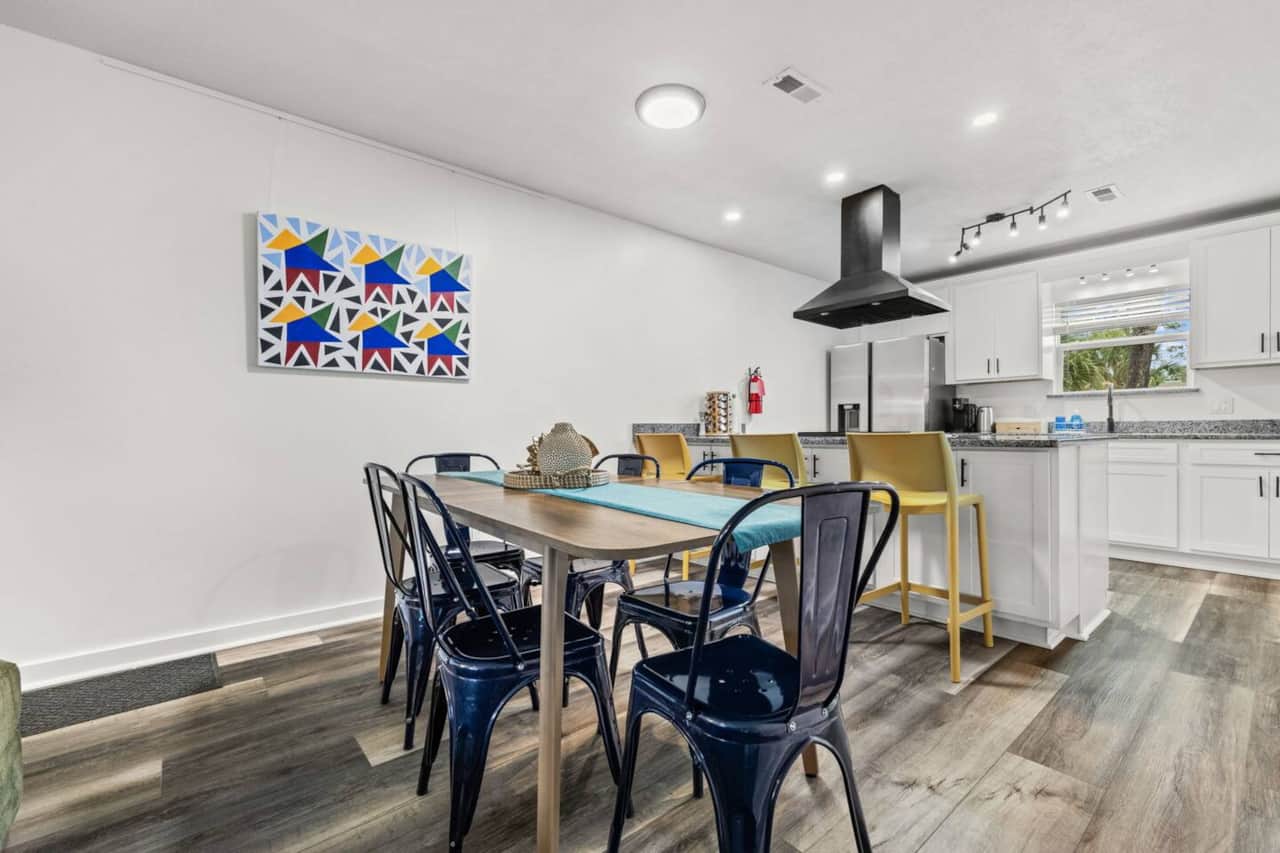 Dine together at the six-seat table, with three additional stools at the island. Dinnerware, cutlery, and wine glasses are provided, and a high chair is available for little ones. The adjoining living room has an oversized sectional and smart TV