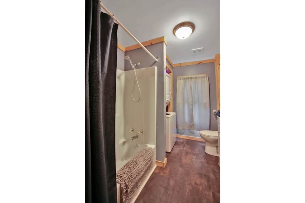 First Level Bathroom, tub/shower combo with washer and dryer