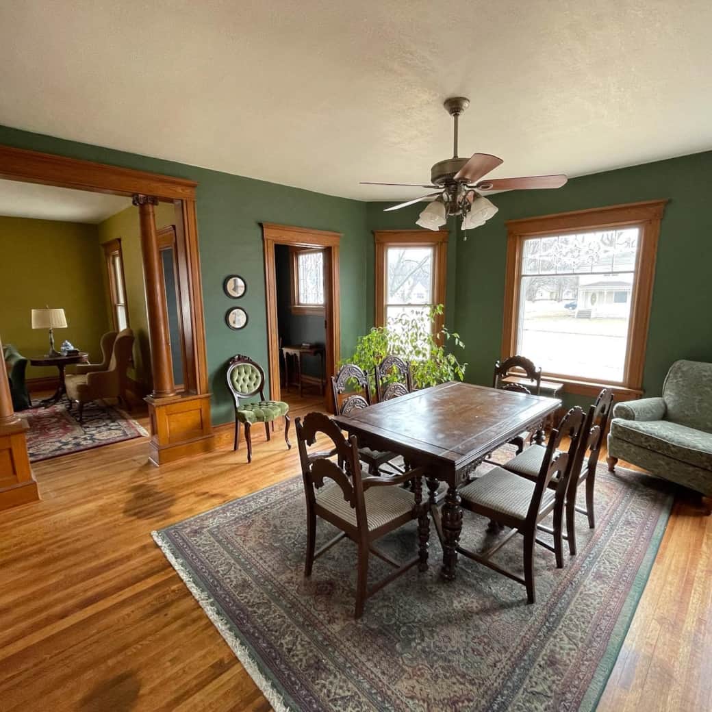 Dining room with view of the beautiful wood work in the living room and front entry. Dining room with view of the beautiful wood work in the living room and front entry.