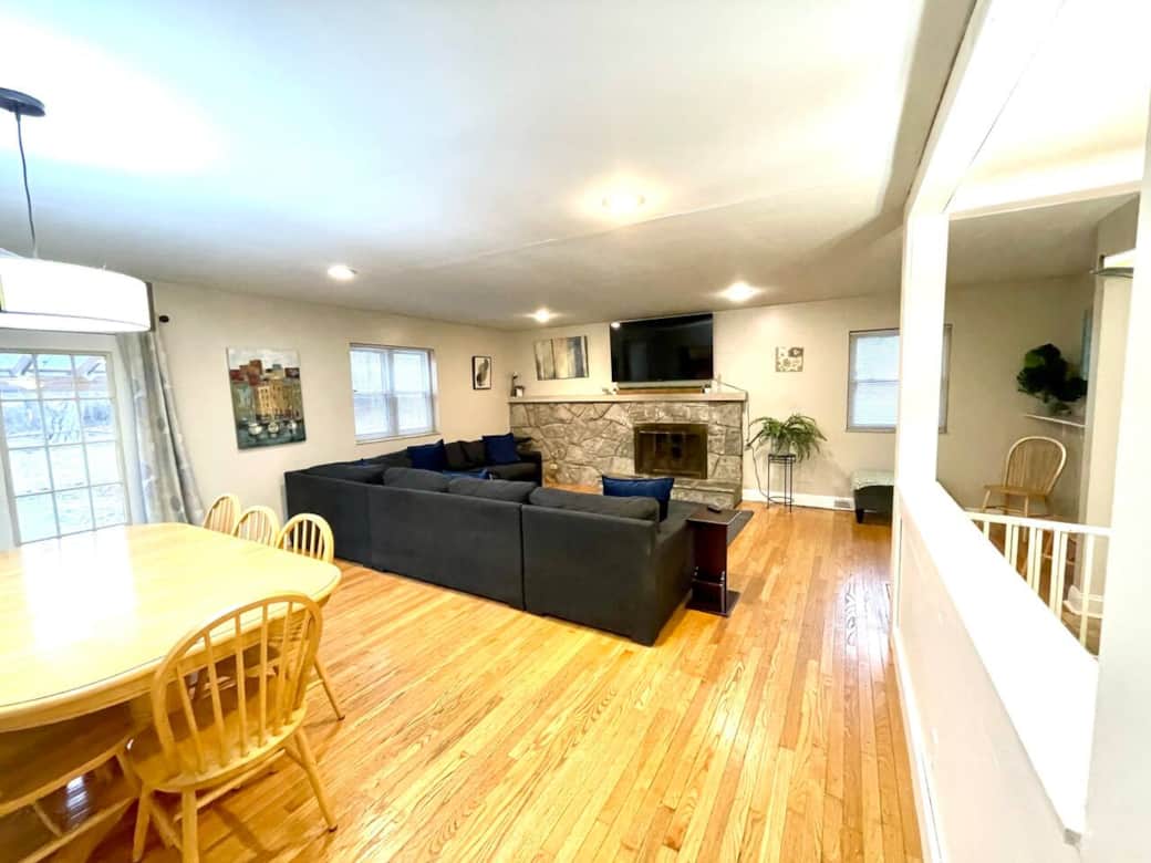 Large living room with sectional couch and Roku TV