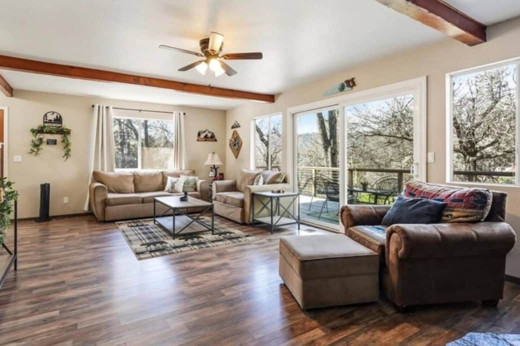 Spacious living room with panoramic windows and natural light