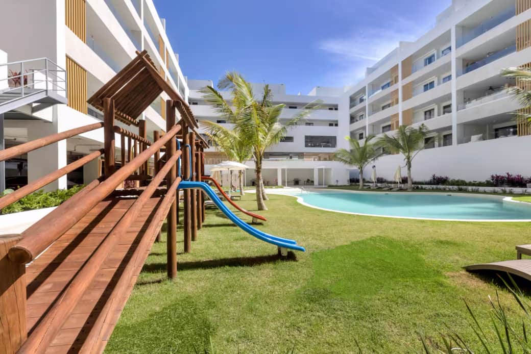 Family-Friendly Pool and Playground Area at Gardenia Condos Punta Cana