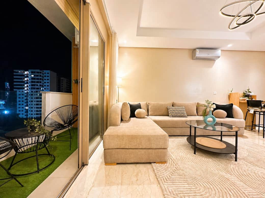 Living room with direct balcony access, offering fresh air and indoor-outdoor comfort.