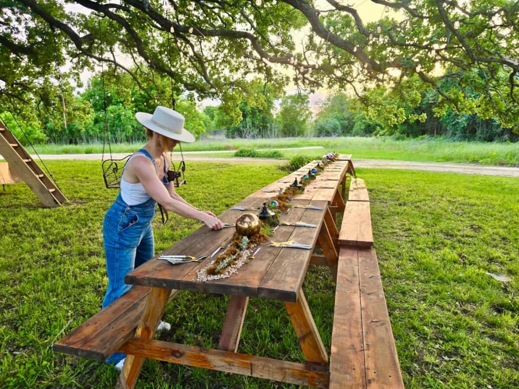 The Happiness Tree features Cedar picnic tables for folks to gather. This living playscape is gently lit at night for festive frolicking. 
