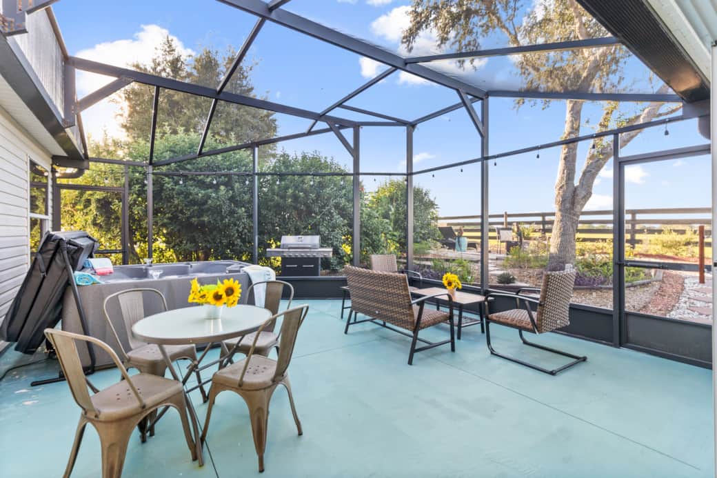 Screen enclosed back patio with hot tub