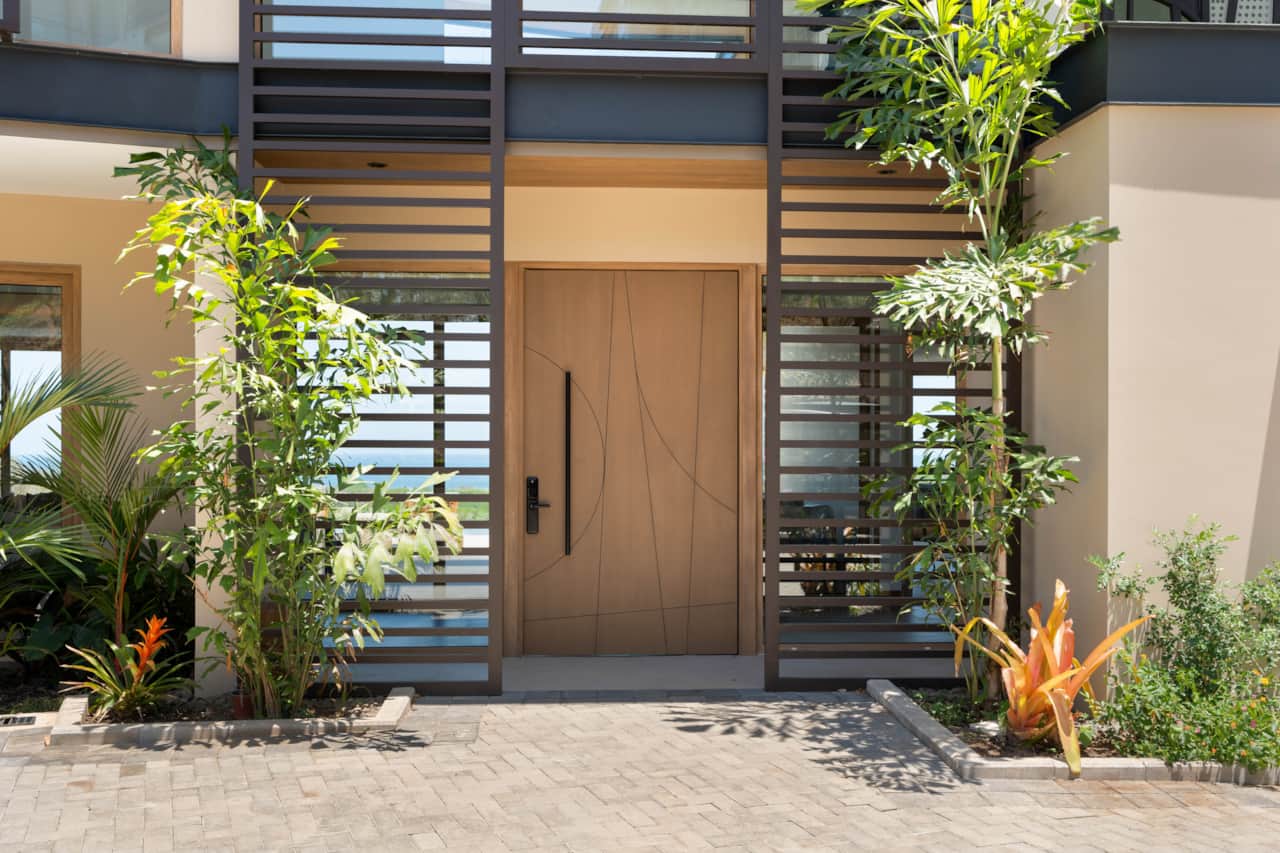 Front entrance of Villa Zaya with tropical landscaping
