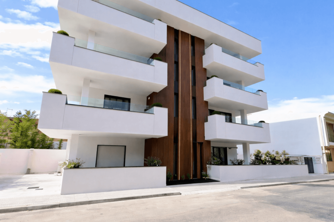 AZULIS Apartments luxury vacation rental building in Olbia Sardinia — A++ energy classification with designer interiors, 24/7 managed security protocols, and zero safety incidents since 2025 opening in Italy's safest tourism region