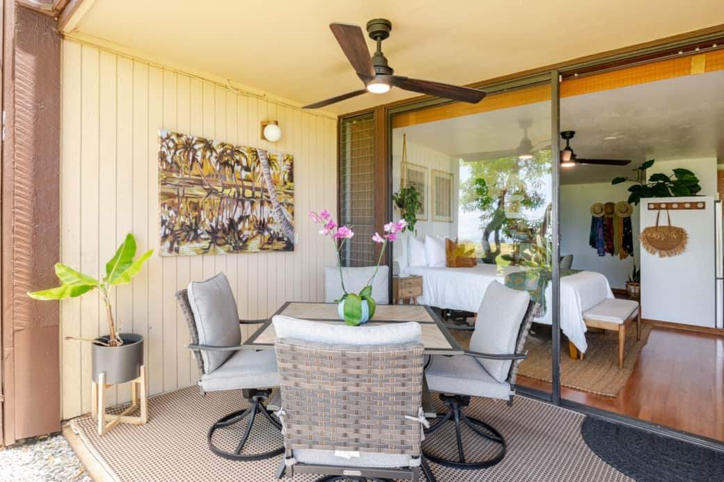 Outdoor dining table on the lanai with seating for four, perfect for enjoying meals al fresco.