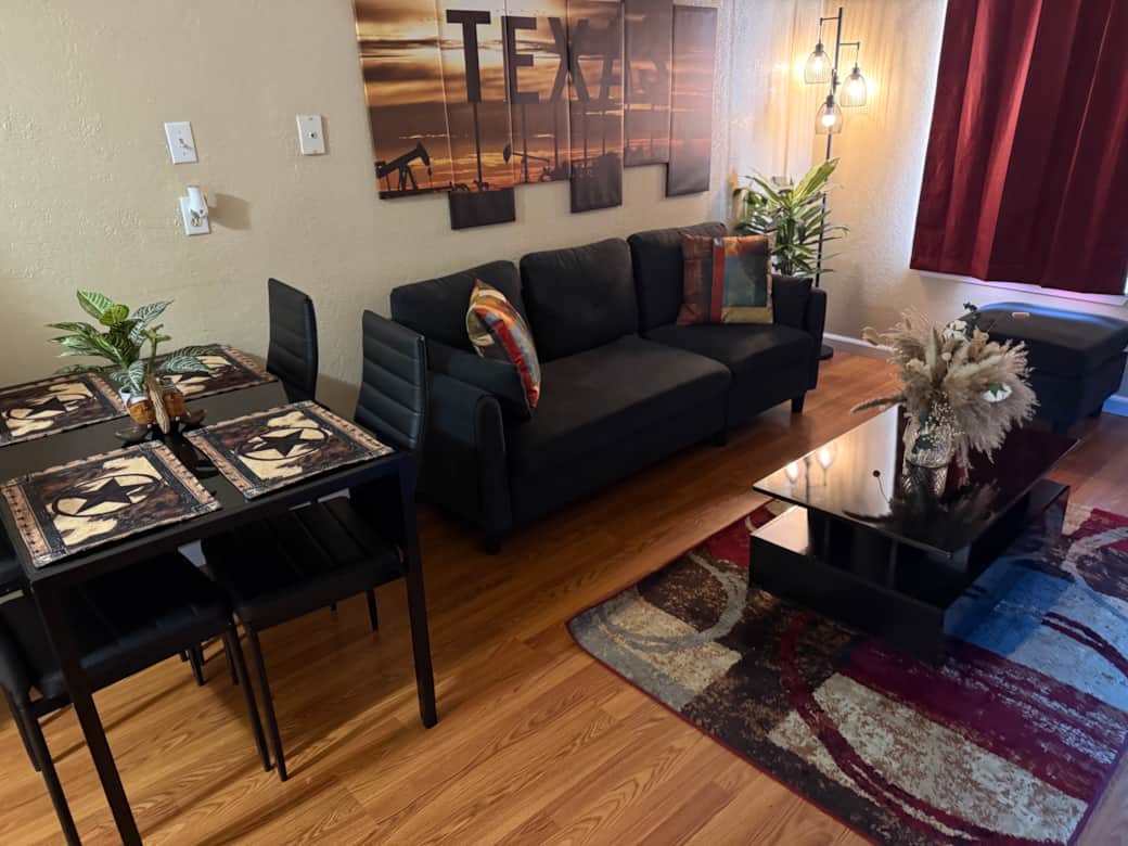Beautiful living room with comfortable couch and futon. 