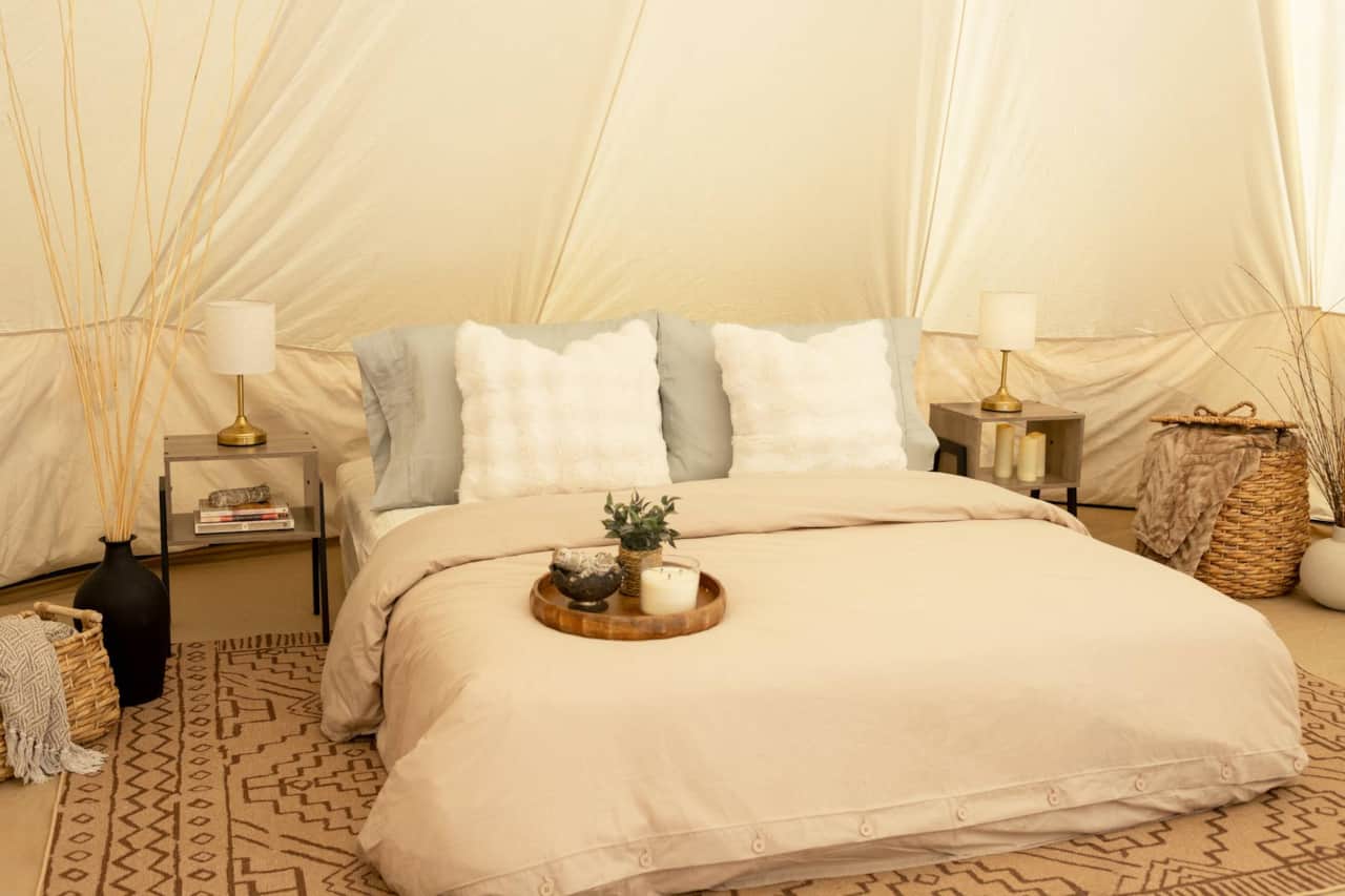 A Cozy Queen Bed Surrounded by Soft, Calming Details