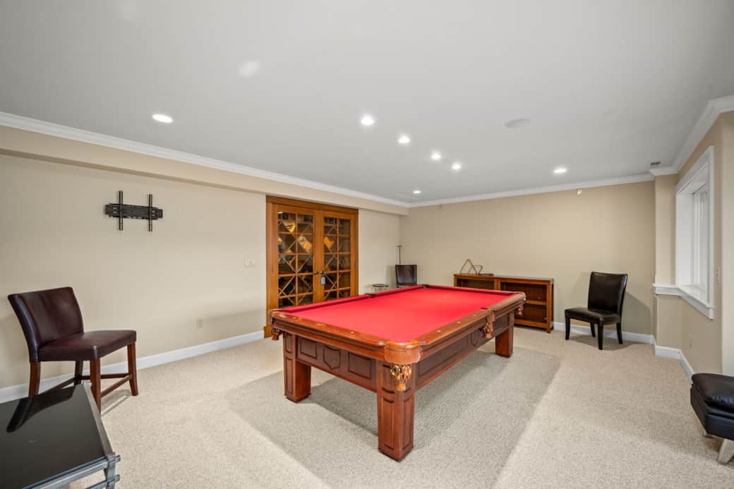 Pool room with custom built wine cellar and soon to be mounted large screen tv 