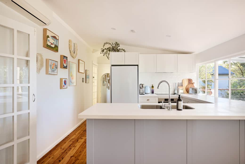 Cooking with Class - Enjoy the expansive views out to the deck with some funky art Cooking with Class - Enjoy the expansive views out to the deck with some funky art