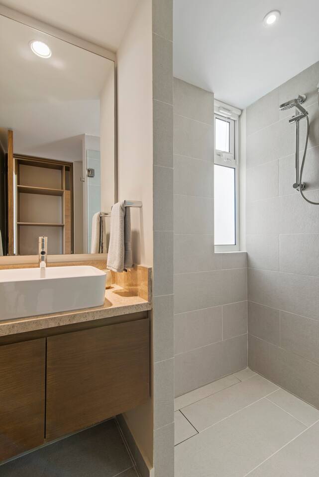 Our bathroom is fully equipped with essentials, including fresh towels, shampoo, conditioner, and soap, providing everything you need for a comfortable stay.