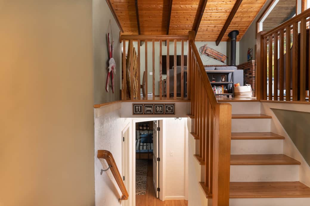 The entryway landing provides a half bath and laundry, and separates the living area from bedrooms.