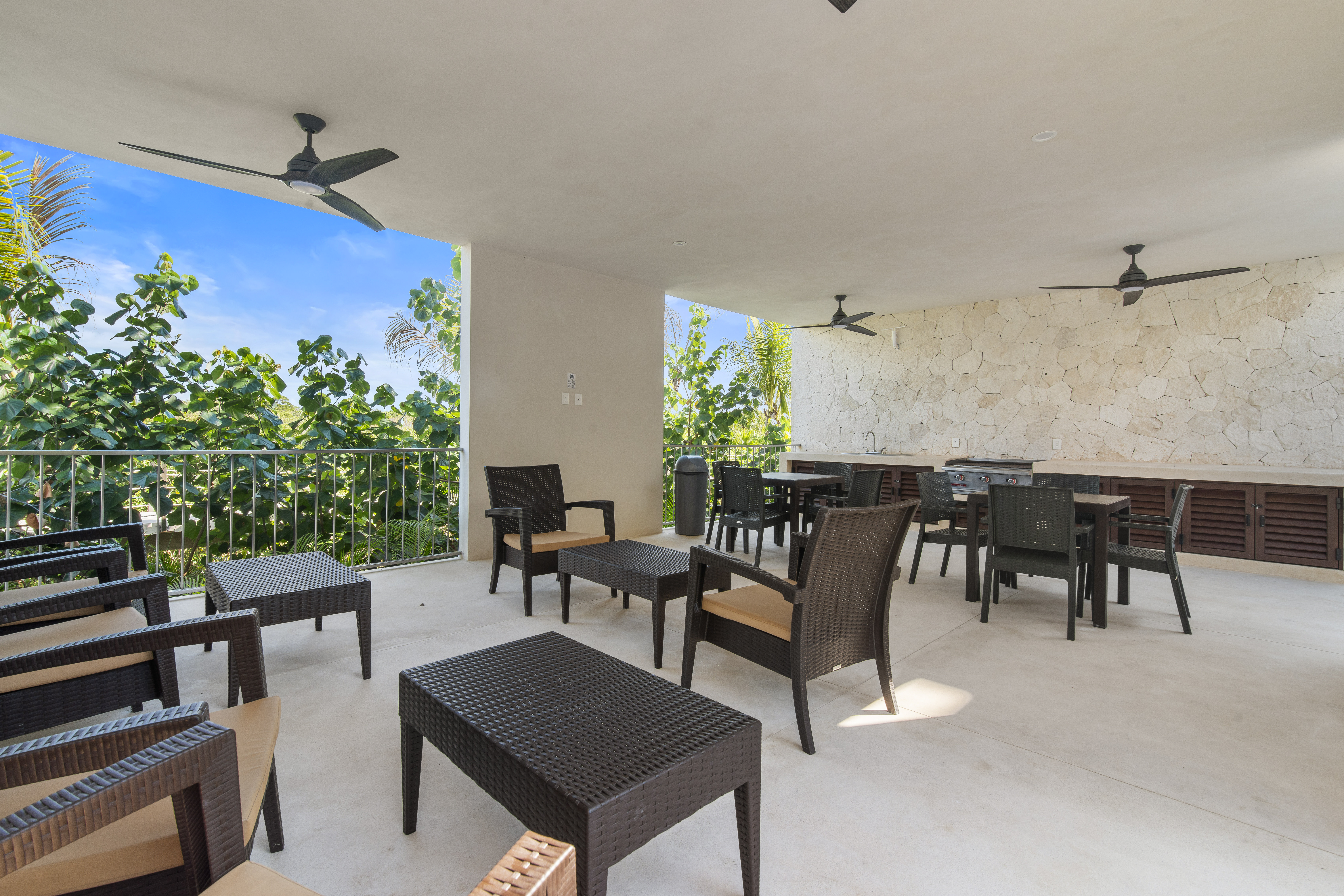 Poolside lounge with a BBQ grill, comfortable seating, and the perfect place to relax outdoors.
