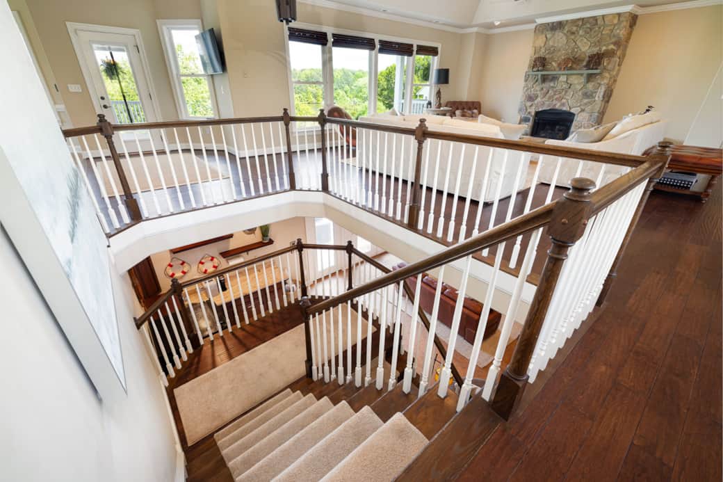 Staircase Leads to Bar and Family Room on Lower Level
