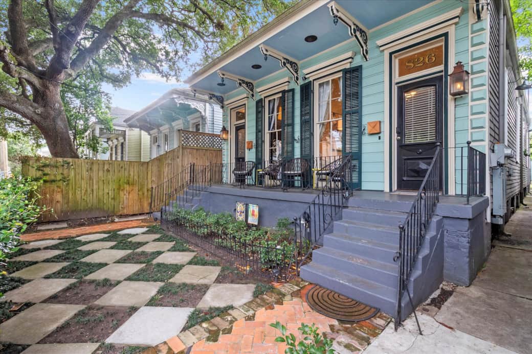 The house is a duplex and the front yard is a shared space