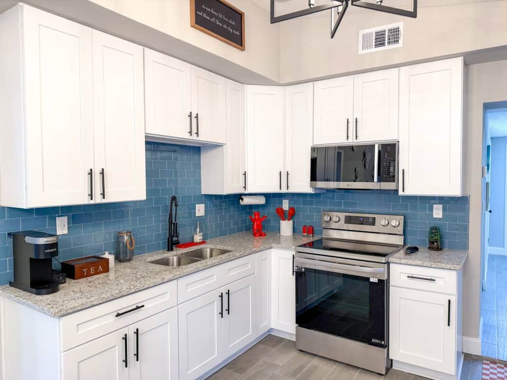 The fully renovated chef’s kitchen features sleek quartz countertops, brand-new appliances, and everything you need for a delicious feast!