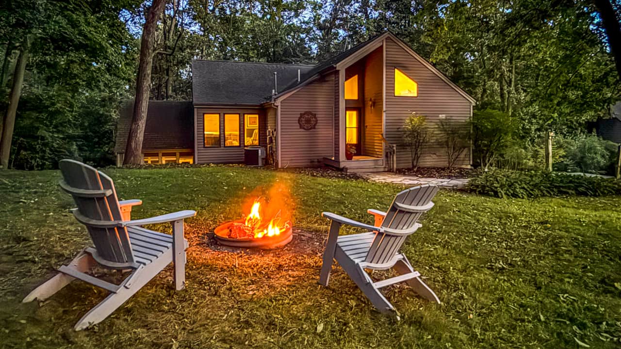 Evening at the Firepit There are 6 chairs around the fire.