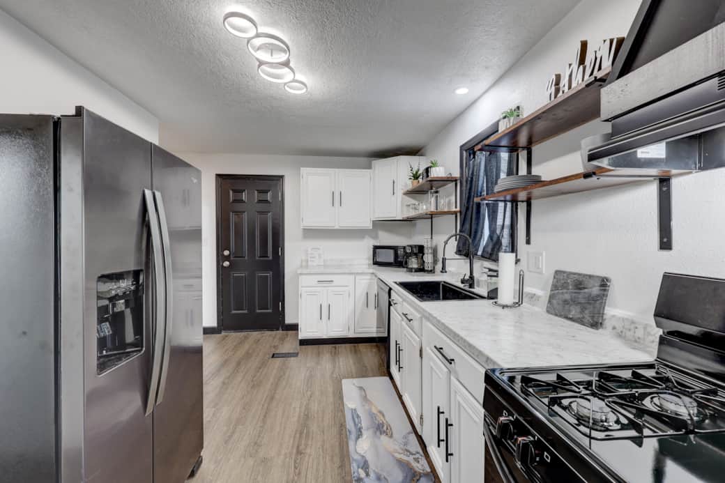 When parking in the back, you'll enter from the back door and find this dreamy kitchen. When parking in the back, you'll enter from the back door and find this dreamy kitchen.