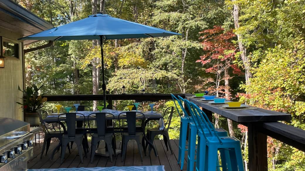 Main level deck dining table/umbrella w/8 seats, counter w/4 seats, lake view