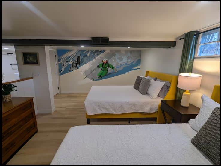 Bedroom with two queen beds and custom mural Bedroom with two queen beds and custom mural