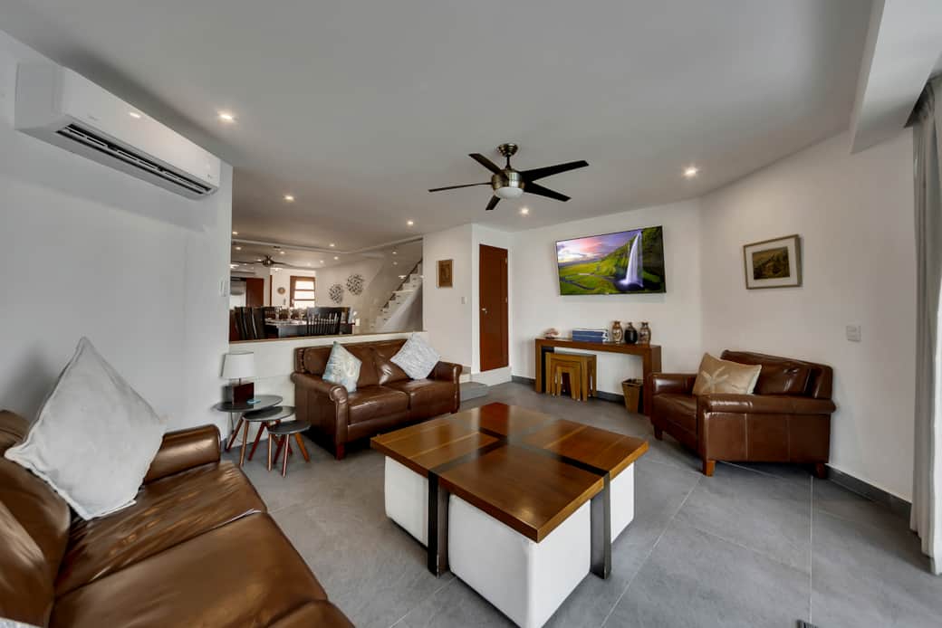 Family room with extra chairs tucked under the coffee table Family room with extra chairs tucked under the coffee table