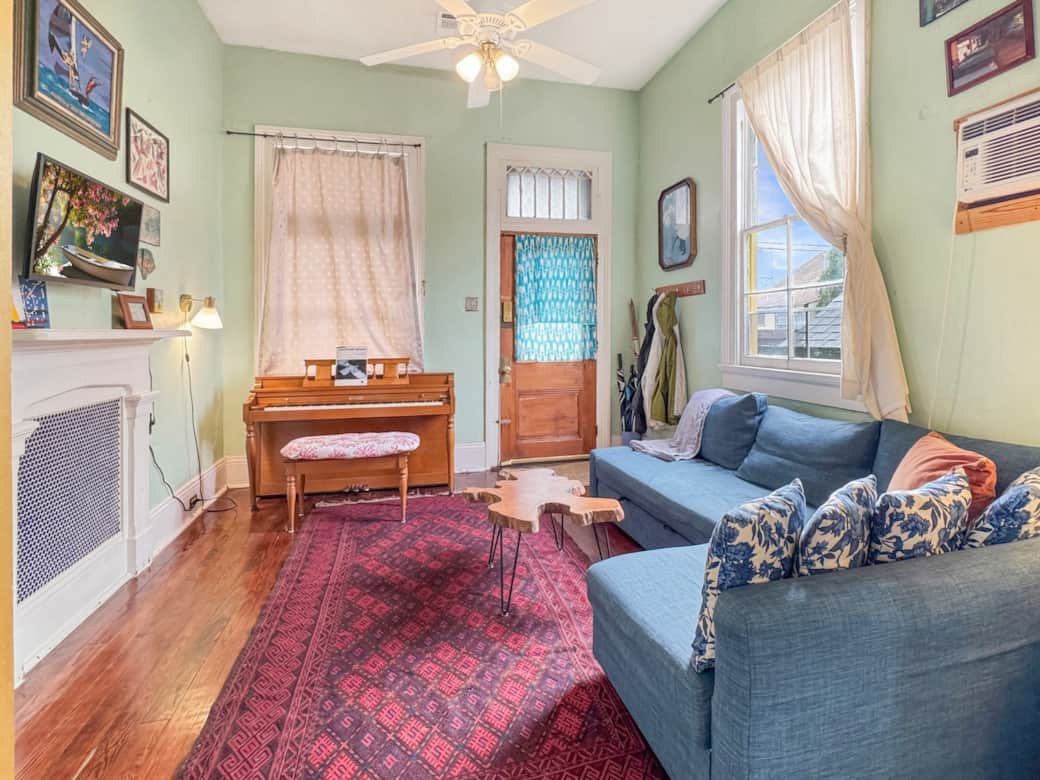 Living room also features a piano!