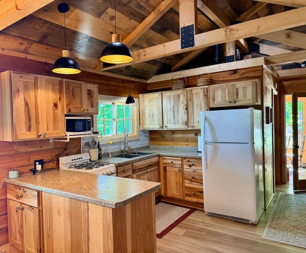 While there's no dishwasher, the kitchen is well equipped with everything from pans to dishes to a lemon squeezer to zip-lock bags. Outside we have a gas grill. 