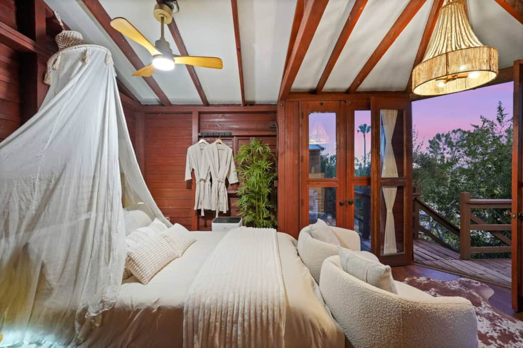 Airy bedroom featuring a ceiling fan to keep the space cool and comfortable. Airy bedroom featuring a ceiling fan to keep the space cool and comfortable.