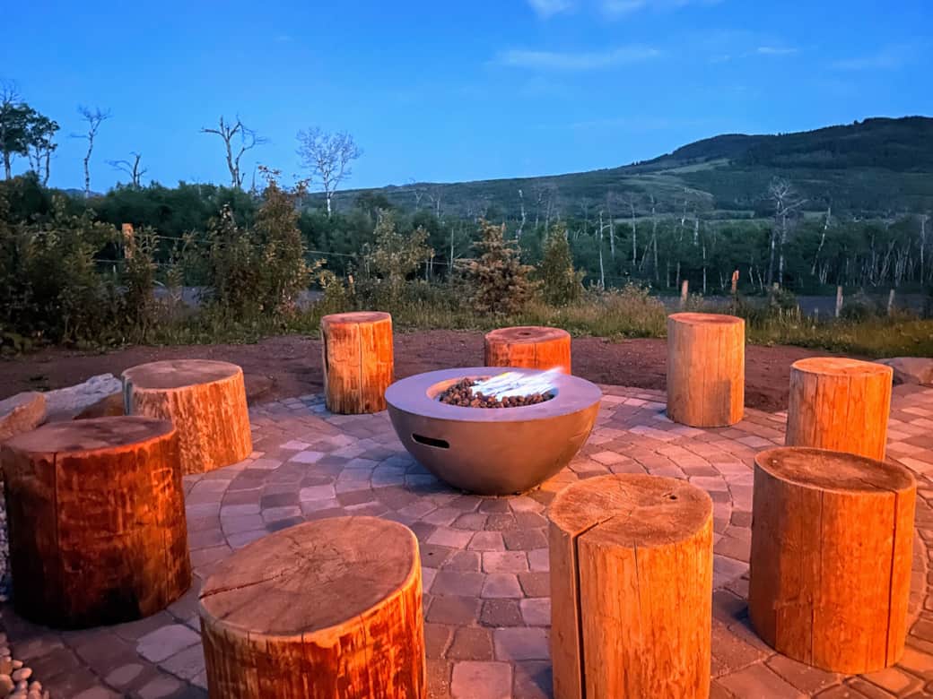 Napoleon fire table with 8 surrounding cedar stump chairs. No cooking on fire please Napoleon fire table with 8 surrounding cedar stump chairs. No cooking on fire please