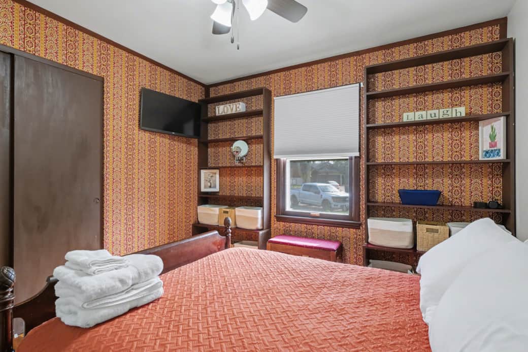 Orange Room - Full size bed, storage in the built-in shelves, Roku TV and power for your devices.