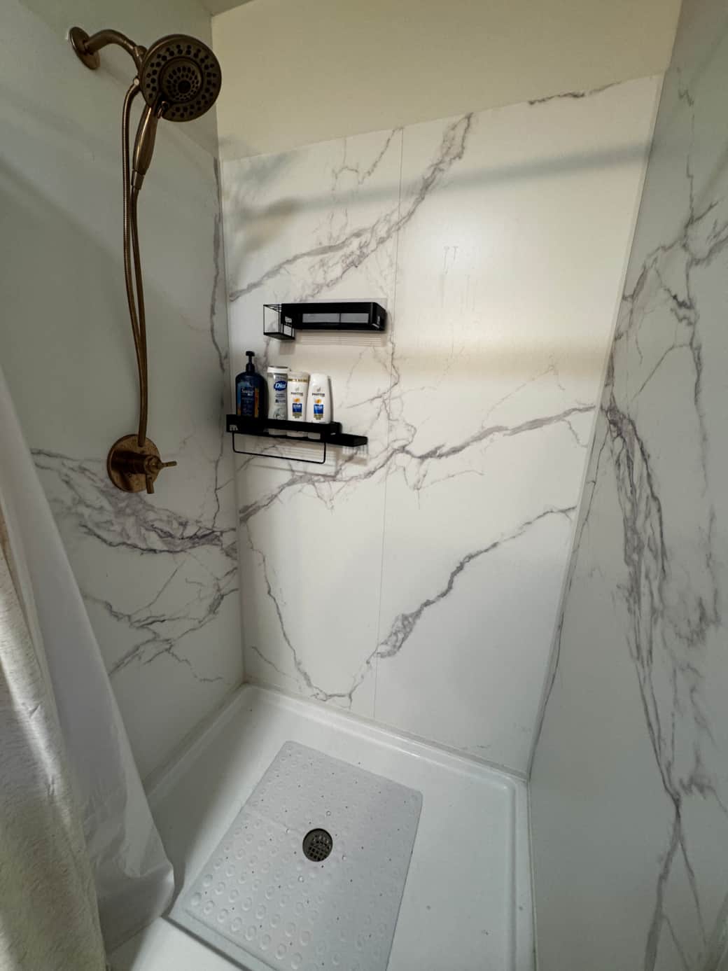Walk in shower with pull down shower head for little ones