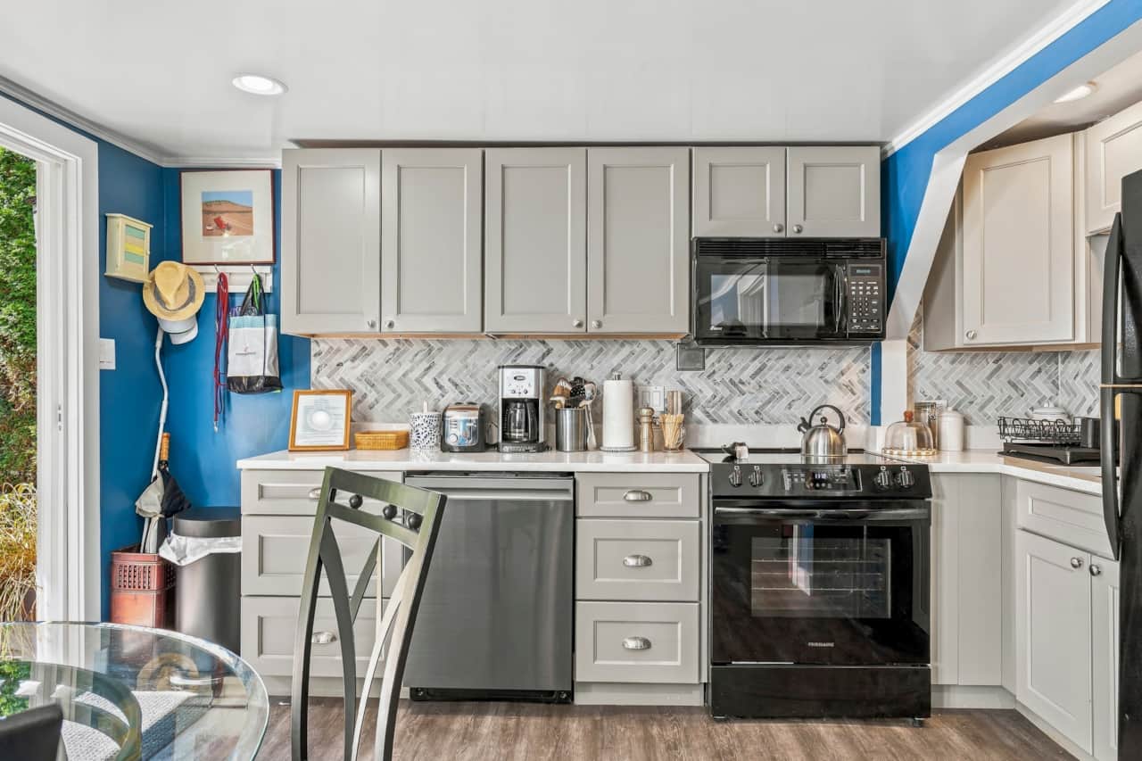 Fully Equipped Kitchen with Refrigerator, Oven, Microwave, and Dishwasher