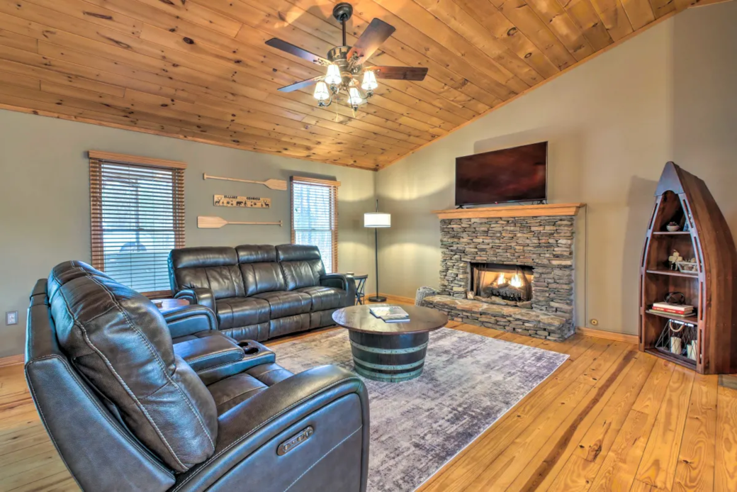 Warm living room with fireplace and comfortable seating.