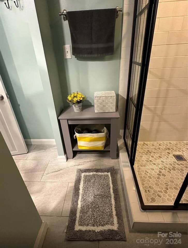 Recently updated downstairs bathroom with a beautiful tiled shower and glass enclosure. Recently updated downstairs bathroom with a beautiful tiled shower and glass enclosure.