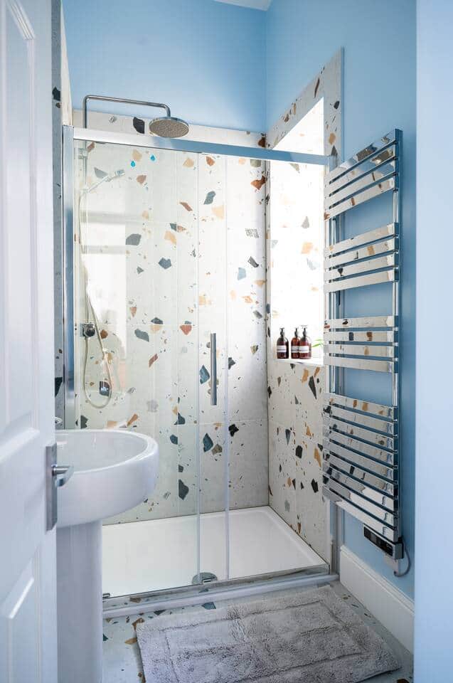 large shower with rainfall head or standard shower head , fully adjustable temperature controls to suit .