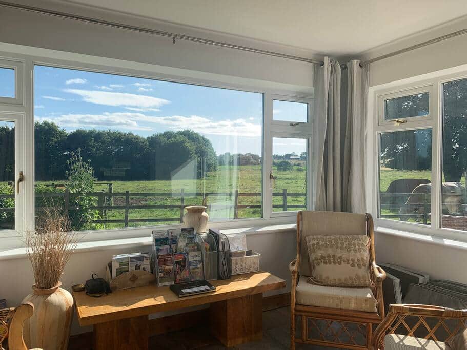 Sunny vistas from the Garden Room over to the Bain Valley Sunny vistas from the Garden Room over to the Bain Valley