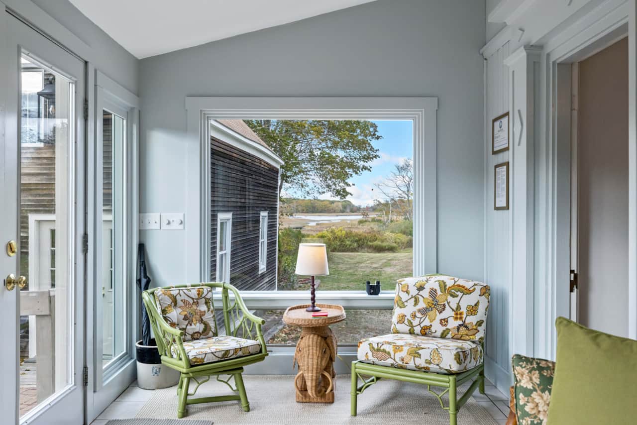 Take in the beauty of the landscape and cove from the back of the property