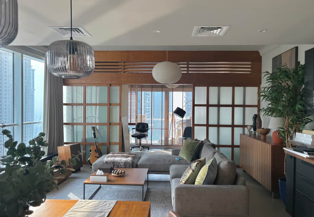 ounge life. Japandi calm meets Dubai skyline. Wrapped in walnut and light.