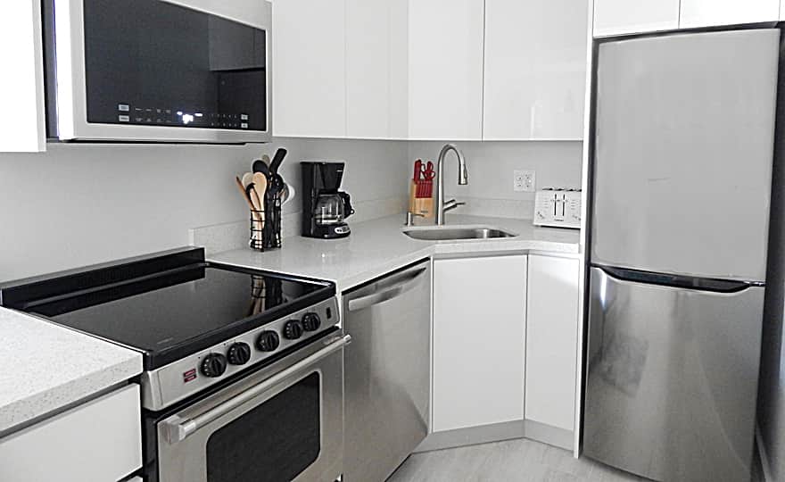 Kitchen with full size appliances. Stocked with essentials to prepare a complete meal.   
