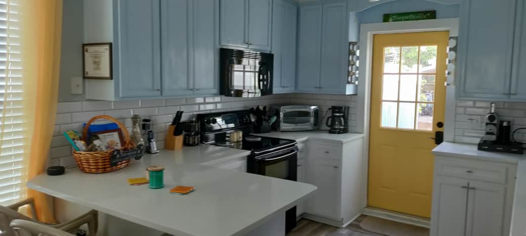 Kitchen and door to back yard and tiki deck