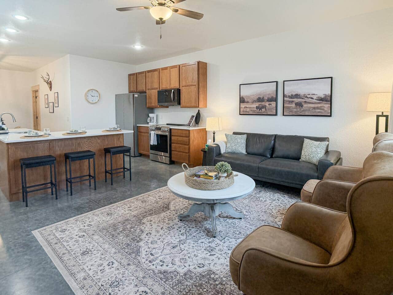 Connect and relax in this open-concept space where the living room flows effortlessly into the kitchen, keeping the whole group together.