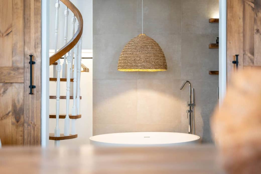 Open space bathroom with a large designer bath for two. 