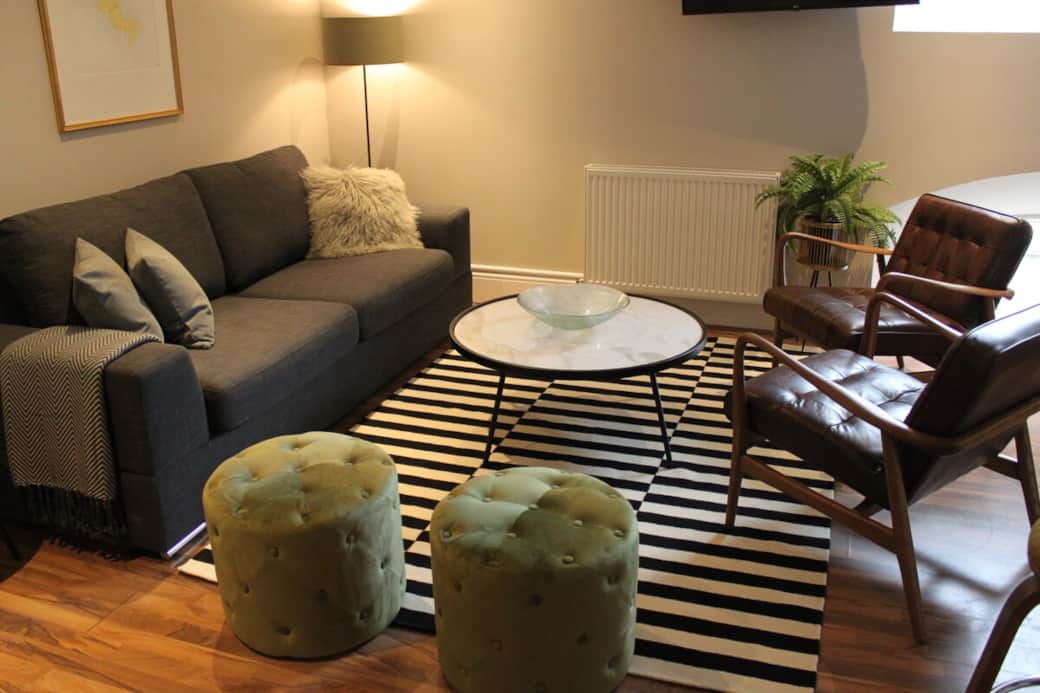 Large lounge/kitchen with dining table and comfortable pull out sofa bed.